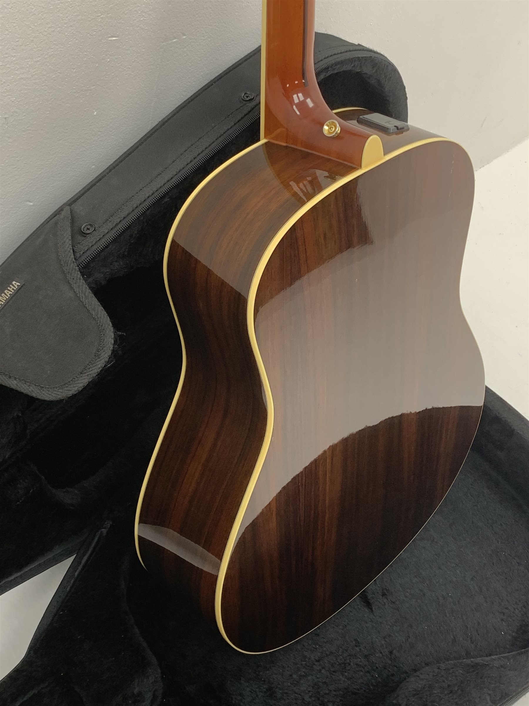  Yamaha model LLX6A acoustic/electric guitar with rosewood back and sides and spruce top, fitted with Yamaha tuner, serial no. QPH150011, L104cm, in hard carrying case. From the collection of the late John Burgess of Beverley who played in the bands Penjants, Wine, Strollers, Revox, Sound Foundation, Pickle Belly Alley, Ragamuffins and Jerryattricks.