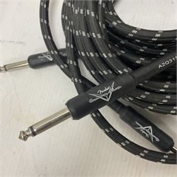 Guitar accessories, to include three Truetone 1 Spot Combo Packs, three Fender California Series speaker cables, including 25ft example, Stagg speaker cables, other cables, mainly Fender, two Fender guitar straps and two sets of amp wheels