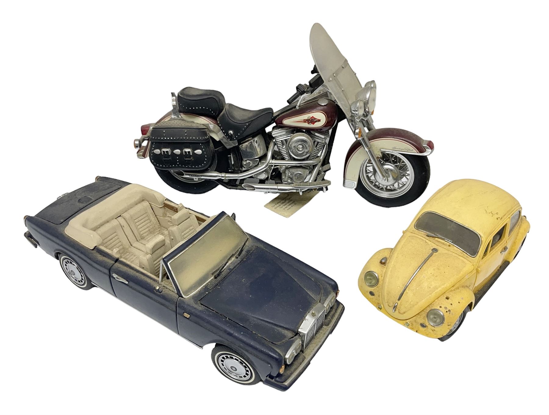Franklin Mint - three die-cast models comprising 1:10 scale Harley Davidson Heritage Softail motorcycle, 1:24 scale 1957 VW Beetle and 1:24 scale 1993 Rolls Royce Corniche IV; all unboxed (3)