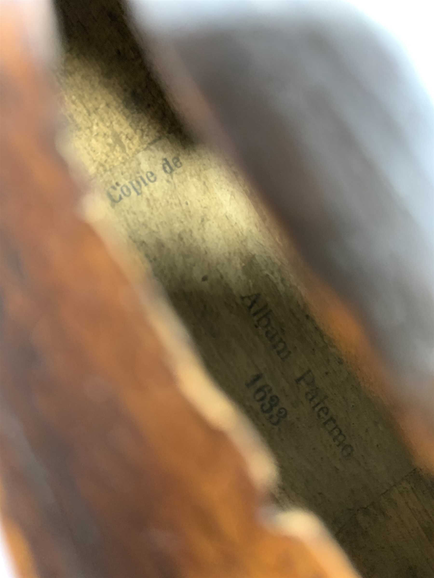  Late 19th century German violin for completion with 36cm one-piece maple back and ribs and spruce top, bears label Copie De Albani Palermo 1633, 59cm overall together with three books on violin construction, restoration and varnishing  