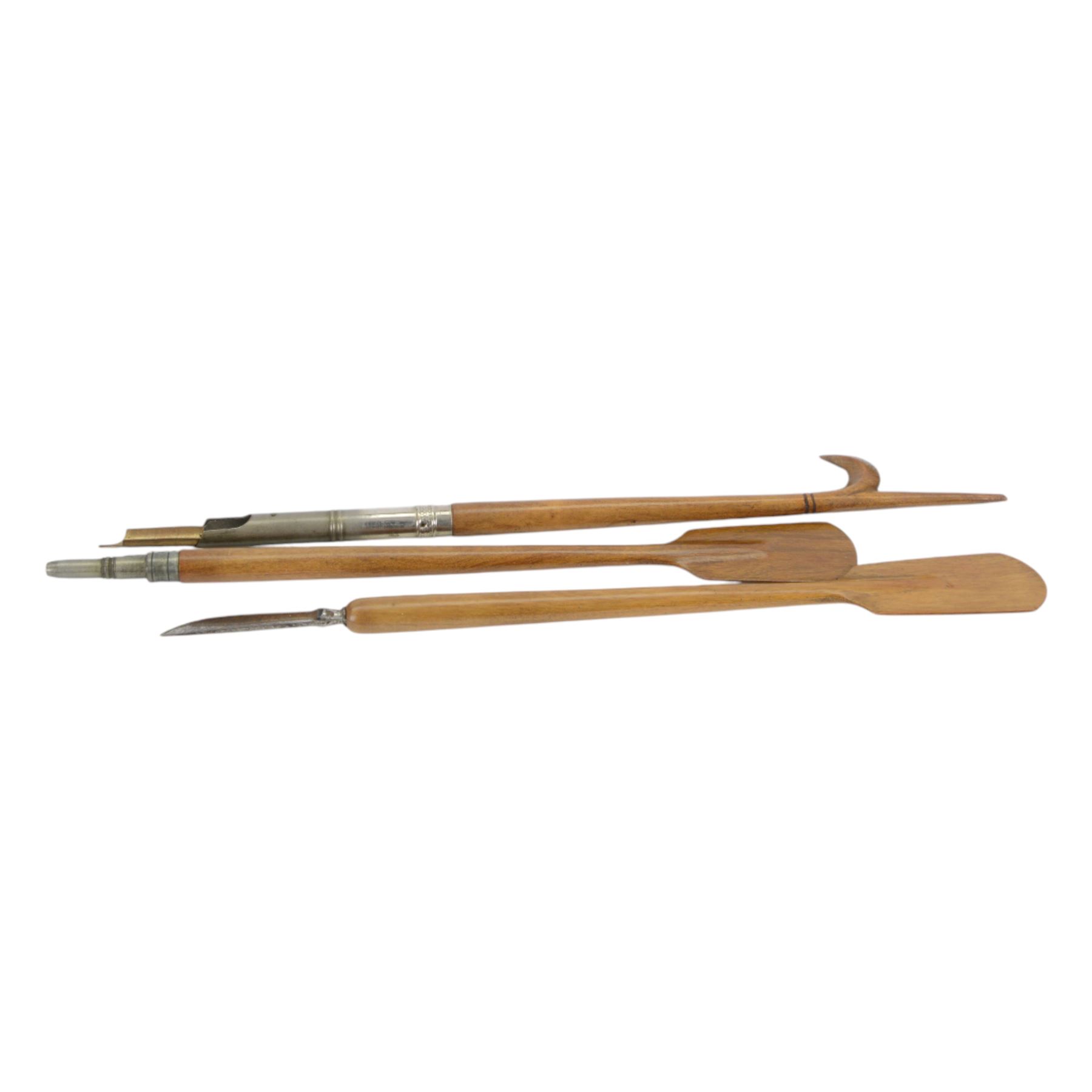 Novelty desk inkwell formed as a boat, with central chimney opening to reveal a metal inkwell with two pens formed as oars, together with another inkwell in the from of a bull dog 