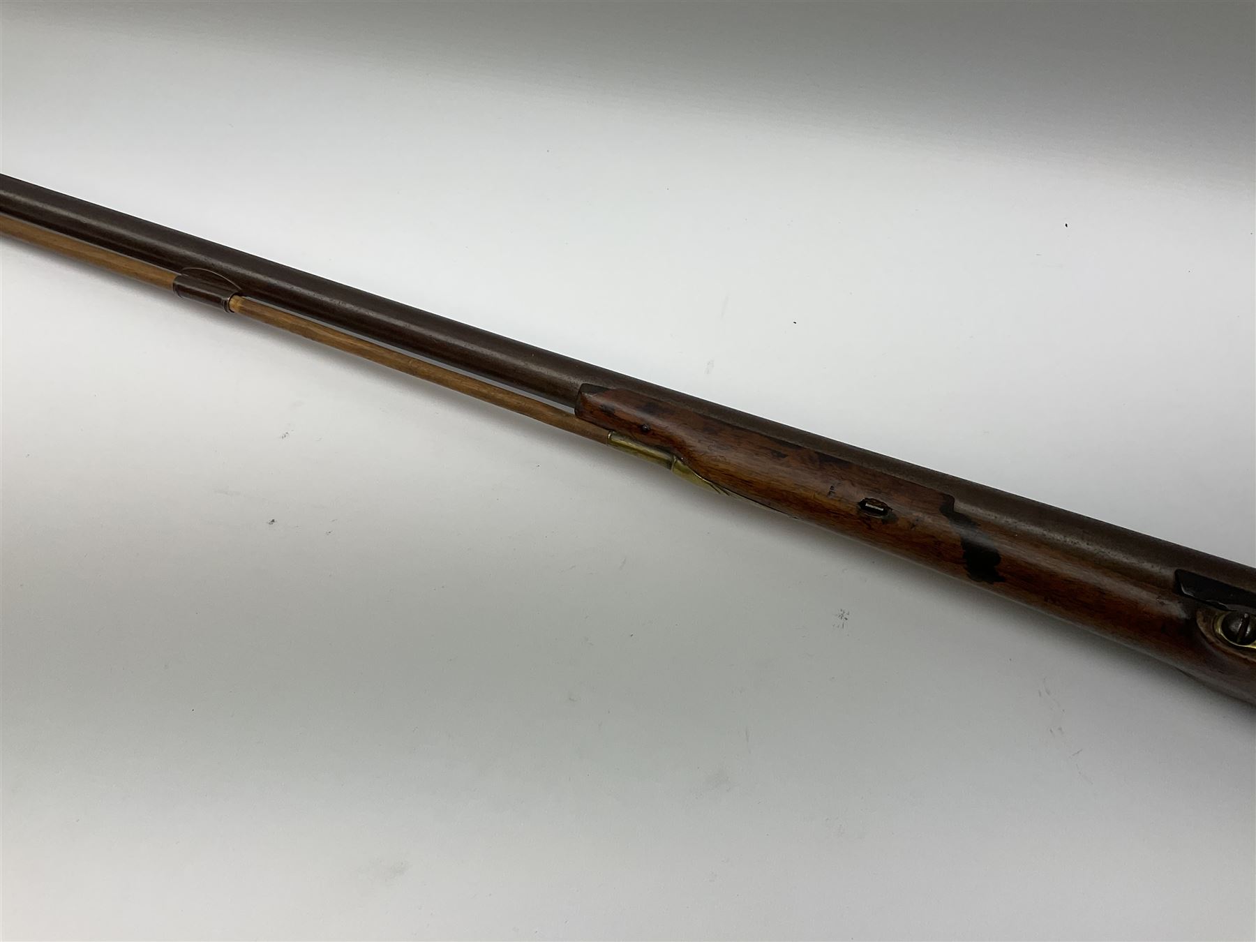 Early 19th century 15-bore flintlock converted to percussion cap fowling piece, the lock stamped T. Richards, walnut half stock with brass fittings including trigger guard with pineapple finial and 91cm barrel with ramrod under L129cm overall