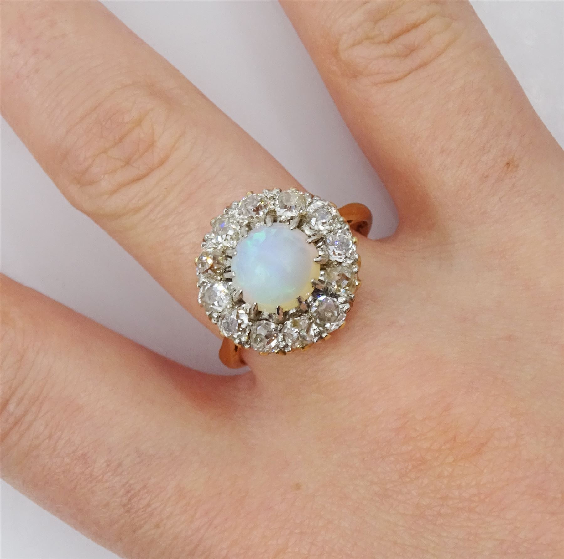 Early 20th century opal and old cut diamond cluster ring, stamped 18ct Plat, total diamond weight approx 1.00 carat