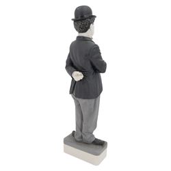 Two Spanish Algora Personajes Del Cine figures, modelled as Charlie Chaplin and Groucho Marx, with printed marks beneath, both with certificates of authenticity, H35cm