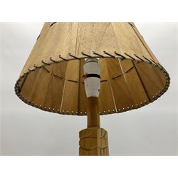 Mid 20th century Paul Caron carved table lamp, modelled as man standing before an oven, the chimney supporting the panelled shade, the base signed P.E. Caron, H42cm