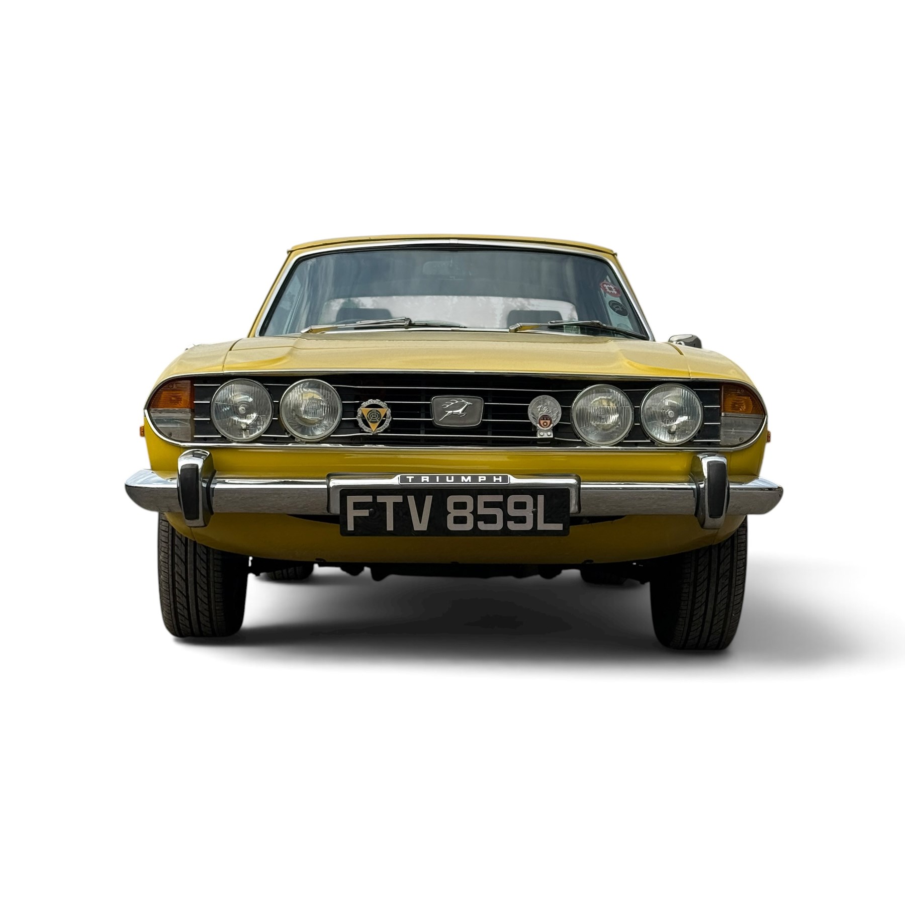 1973 Triumph Stag Mk II 3.0 V8 Manual with Overdrive

Registration: FTV 859L
Date of first registration: 8th March 1973
Recorded mileage: approximately 50,000 miles
Engine: 2,997cc petrol V8
Transmission: four-speed manual with overdrive

An attractive manual-overdrive example of Triumph’s celebrated V8 grand tourer, finished in yellow and supplied with both a removable hardtop and folding soft top.

The car has been the subject of extensive restoration and mechanical work, supported by a large history file containing invoices, notes and photographs documenting the work undertaken. The accompanying records indicate that the engine was rebuilt at approximately 36,000 miles, including re-boring of the block, checking and machining of the top faces, and steam cleaning following machining.

Further work and replacement parts are understood to include an upgraded radiator, electric cooling fan, Stag Webber header tank kit, complete set of cooling hoses and clips, fuel pump and filters, alternator, distributor cap, HT leads, spark plugs, front brake calipers and hoses, rear brake cylinders, tyres, front lights and LED bulbs. Various seals, interior trim items and seat components have also reportedly been renewed.

The car is believed to have been dry-stored from 1994 until 2017, with a substantial programme of recommissioning and improvement subsequently undertaken between 2017 and 2023. The history file also includes earlier MOT certificates dating from 1988 to 1994.

Offered with its V5C, hardtop, soft top, extensive restoration and maintenance history, photographic record and a quantity of useful spare parts, including a new dashboard veneer set.