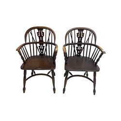 Pair late 20th century oak Windsor elbow chairs, double hoop and stick back with pierced and fretwork work splat, dished seat on turned supports joined by crinoline stretcher