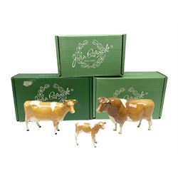 Beswick Guernsey cow family group, comprising bull 'Sabrina's Sir Richmond' no 1451, cow no 1248a and calf no 1249a, all with printed mark beneath and with original boxes 