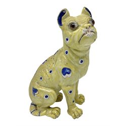 Faience model of a pug in the style of Emily Galle, naturalistically modelled, the head inset with brown glass eyes, glazed and painted with hearts and circles upon a yellow ground, GR signed to the foot, H32cm