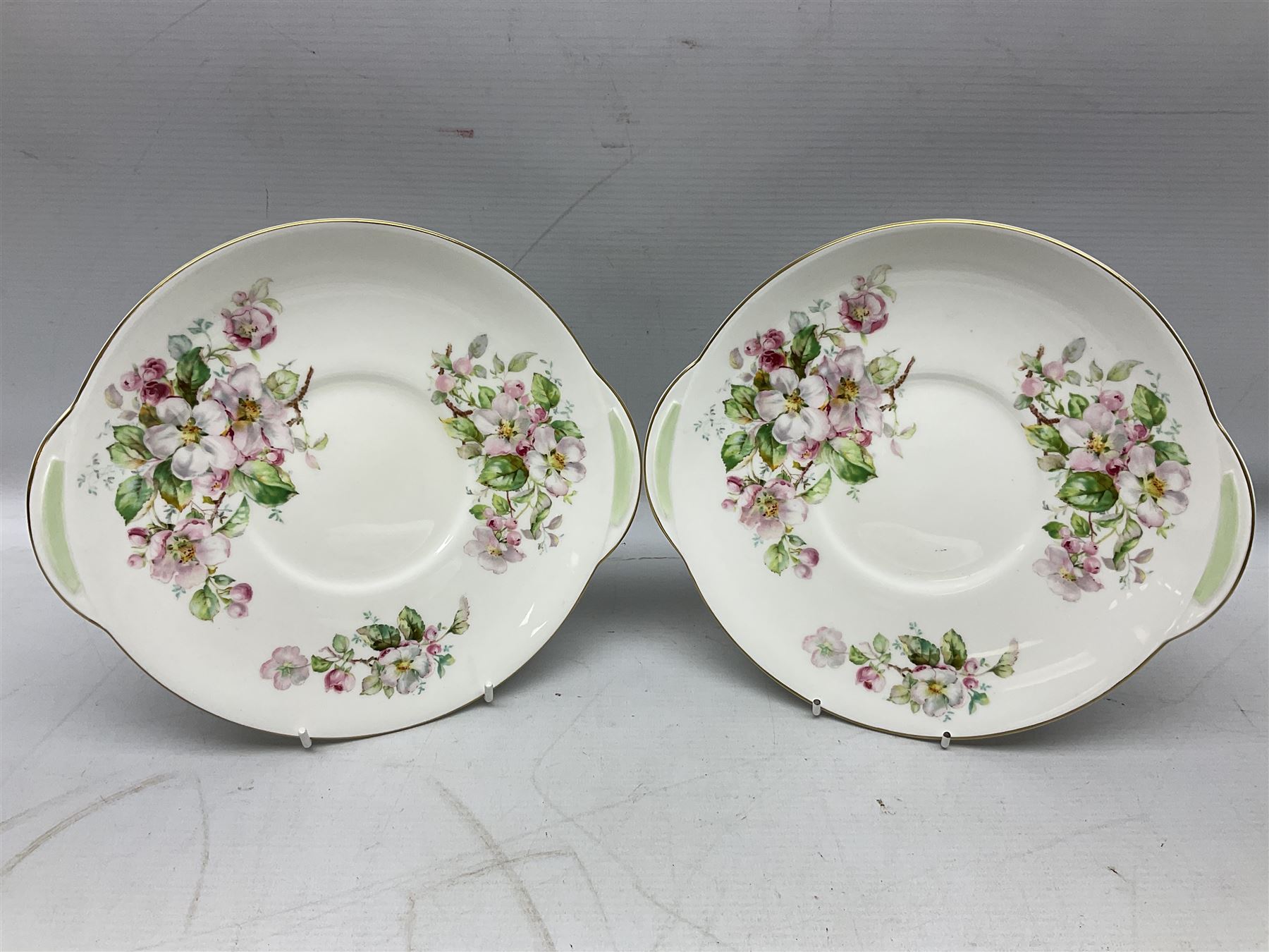 Royal Doulton Apple Blossom pattern tea service for twelve, comprising twelve saucers, twelve tea plates, twelve teacups, milk jug, sucrier and two cake plates