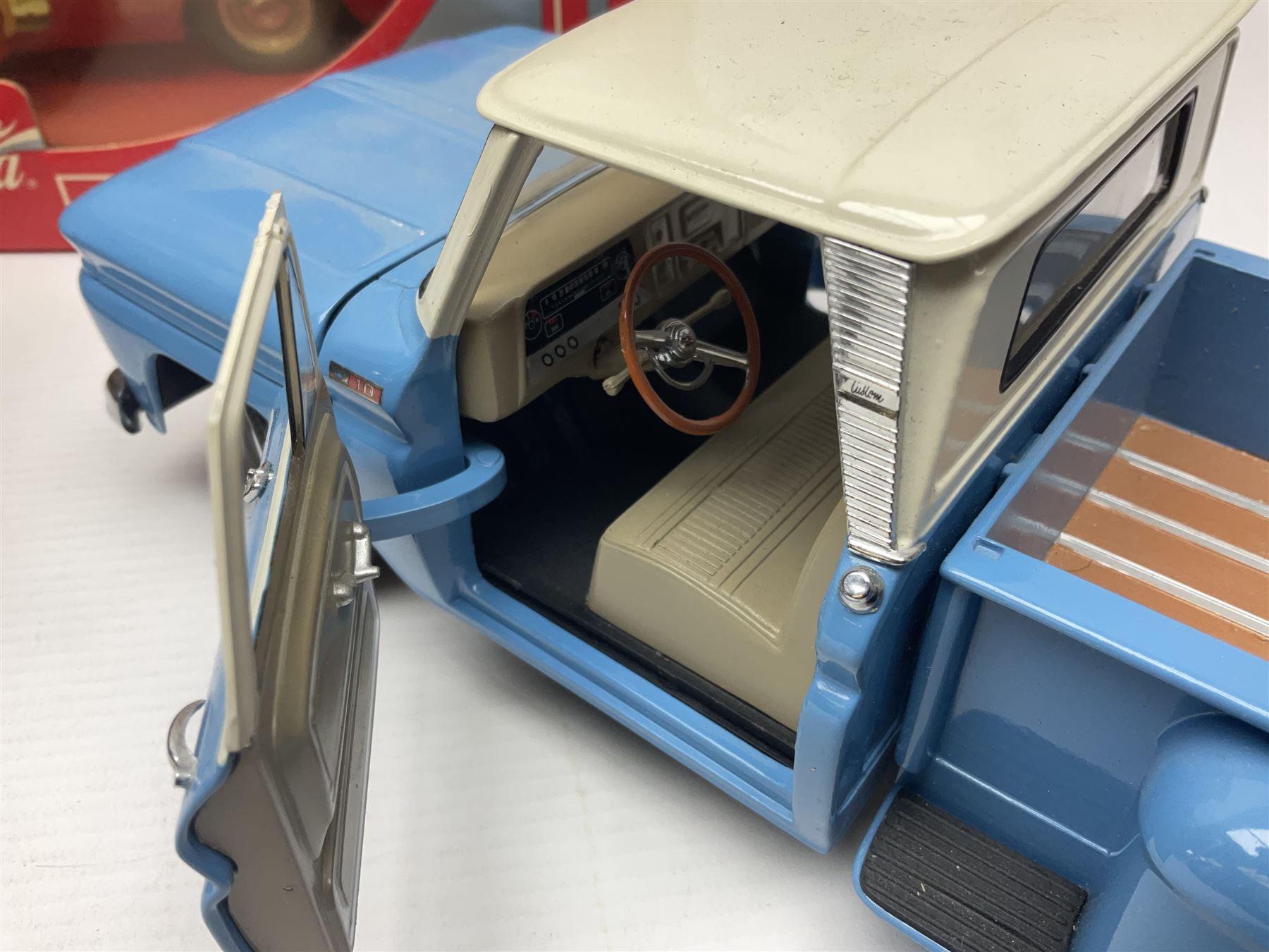 Seven 1:18 scale die-cast models by Ertl, Road legends, Maisto, Solido etc including two Coca Cola promotional vehicles; five boxed (7)