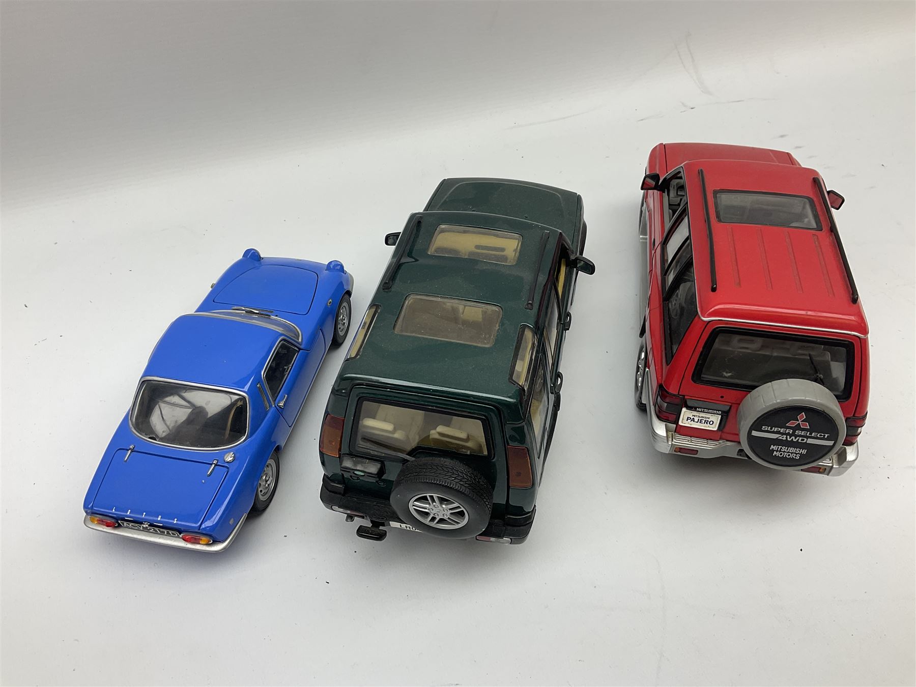 Nine 1:18 scale die-cast models including Ertl Chevrolet; Norev Renault 16; Sun Star Mitsubishi Pajero and Lotus Elan; Motor Max Land Rover Discovery; Road Tough Mercedes Benz 500SL etc; all unboxed (9)
