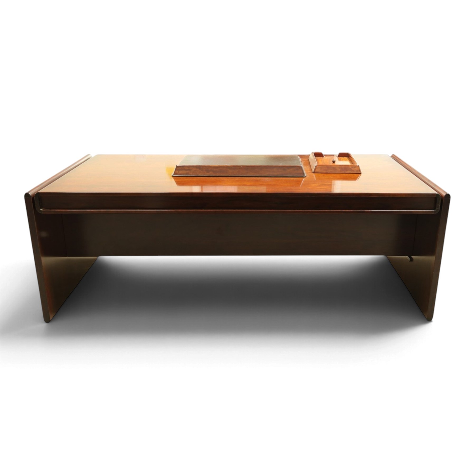 Dyrlund - Santos rosewood office suite, comprising an executive desk and cream leather upholstered swivel chair, the desk with a broad rectangular top with rounded corners, leather writing surface, pen compartments and letter tray, three lockable frieze drawers with fitted interiors above a central kneehole flanked by floating drawer pedestals, the left housing a filing drawer and the right three compartmented drawers, with a full width modesty panel to the reverse, chair raised on a castor base, H 116cm, W 62cm, D 74cm