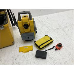 Trimble land surveying equipment - 5000 Series 5603 DR300+ Robotic Reflectorless Total Station, serial no.84310406; in carrying case; together with GPS Holder 58317019, serial no.95320184; ACU 571225500, serial no.83214786; Docking Station 58252019, serial no.95823458 with Power Supply; RMT 606 Remote Target on pole with CU Holder and External Georadio 2.4GHz; cased Power Pack Kit; folding tripod; and aluminium 5m telescopic measuring staff