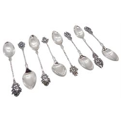 Set of eight Victorian silver spoons, the terminals modelled as flowers from The Union, comprising three with thistle terminals, three with rose terminals, and two with clover terminals, hallmarked Haseler Brothers, Birmingham 1894, approximate total weight 3.62 ozt (112.6 grams)