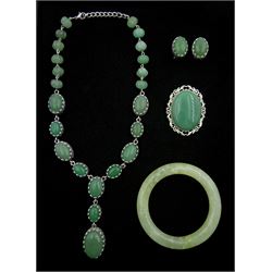 Collection of jade jewellery including bead necklace, pair of stud earrings, brooch and bangle