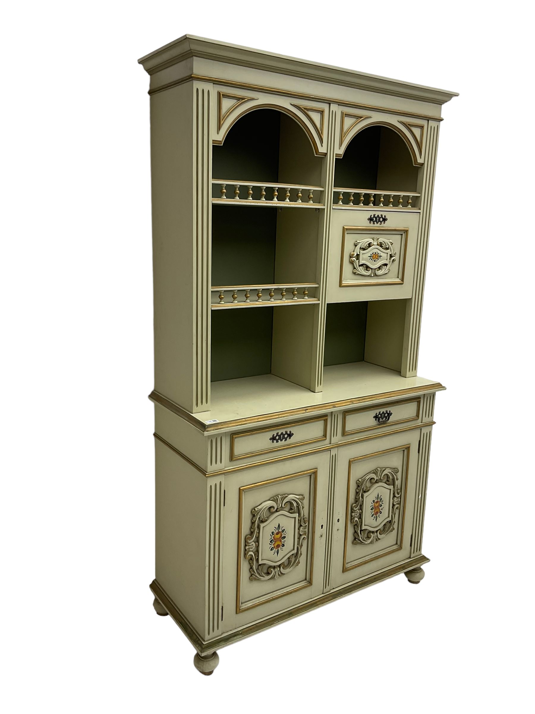 Portuguese painted dresser, two-tier plate rack with spindle gallery and fall-front cupboard, flanked by fluted uprights, fitted with two drawers over two cupboards, the panelled cupboards with floral decoration and a rinceaux border, white painted and parcel-gilt 