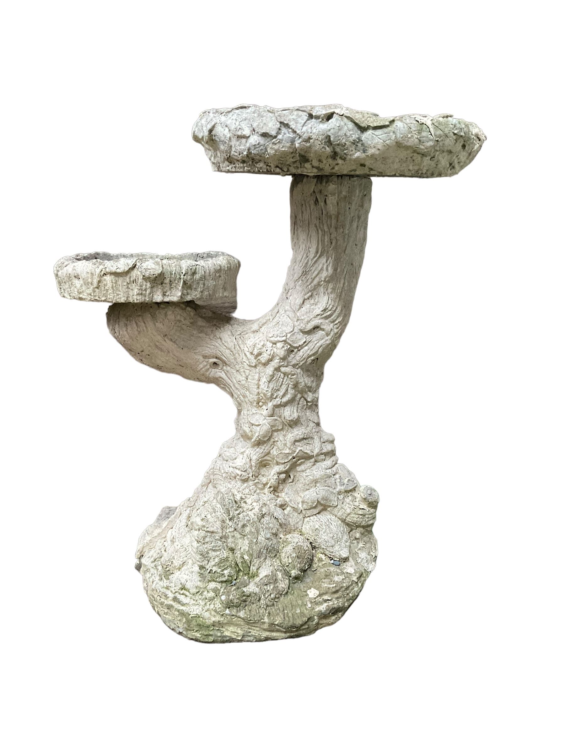 Two cast stone tree bird baths