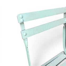 Wrought metal folding garden table, with painted wood plank top; and four matching folding chairs