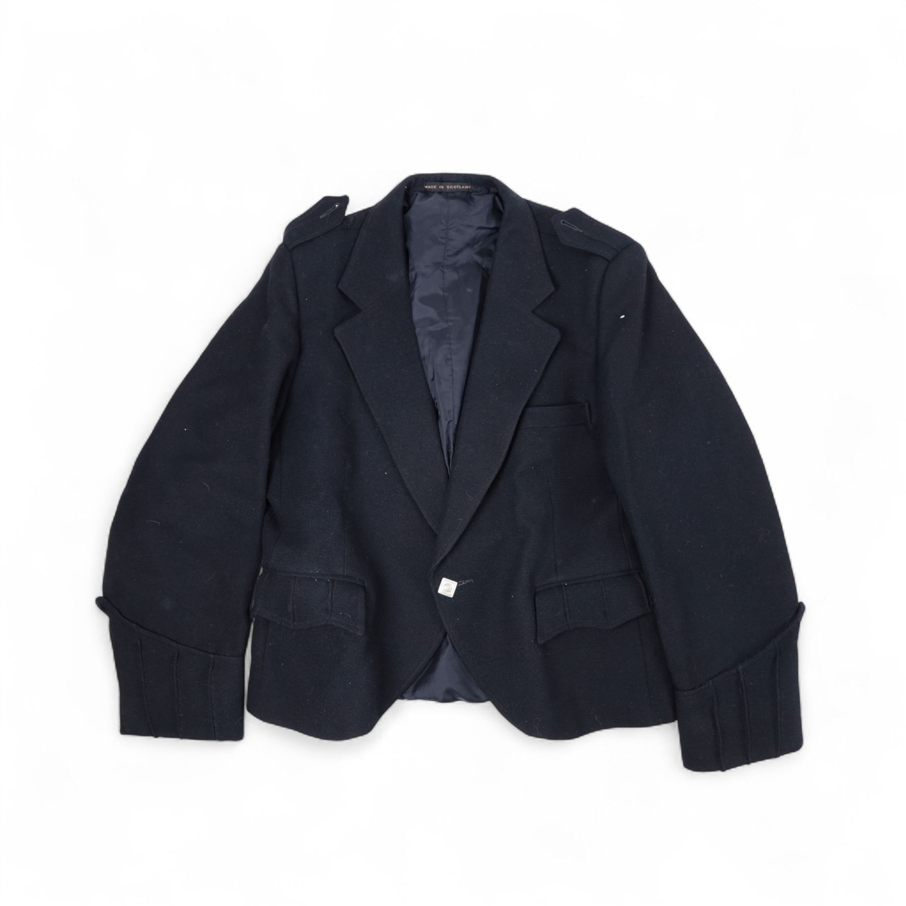 Piping regalia, comprising Armstrong tartan kilt with two kilt pins, three sporrans, including fur example, two jackets, Glengarry hat, other hats, collection of shirts, socks, ties, Hecsan shoes, dirk and belt