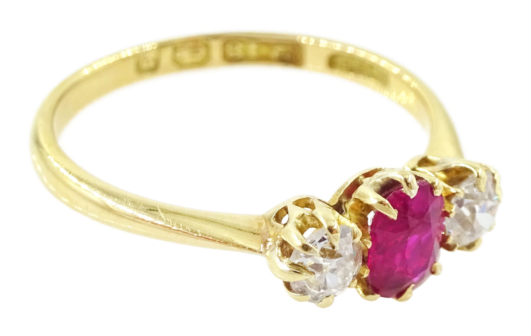 Victorian 18ct gold ruby and diamond three stone ring, single oval cut ruby of approx 0.45 carat, with a single old cut diamond set either side, Birmingham 1898, total diamond weight approx 0.35 carat