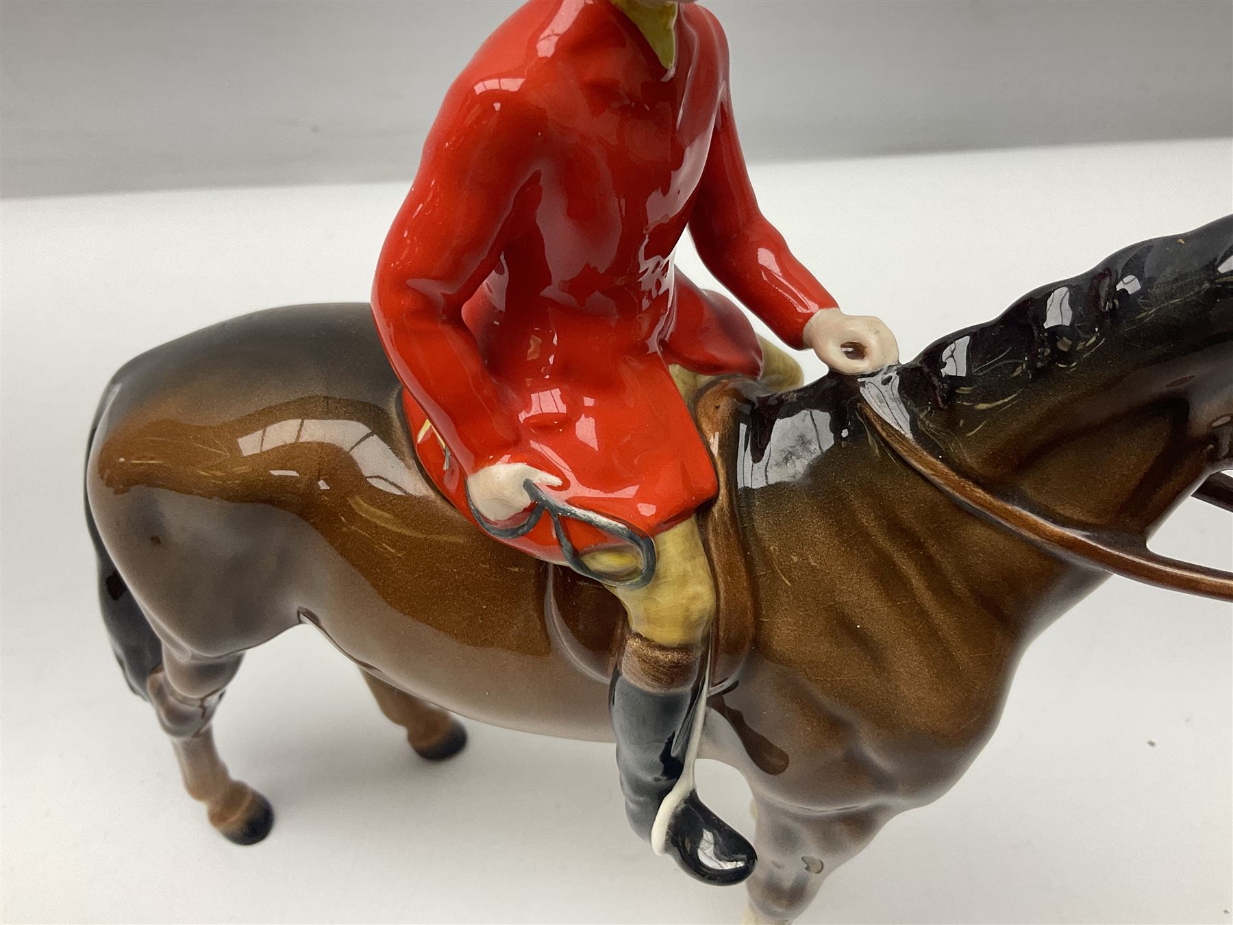 Beswick huntsman upon a bay horse no. 1501, with printed mark beneath, H22cm