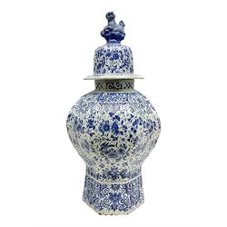 Large Delft blue and white vase and cover, of reeded baluster form, the domed cover with dog finial, decorated throughout with birds, flower heads and foliate motifs, with painted marks beneath, H55.5cm