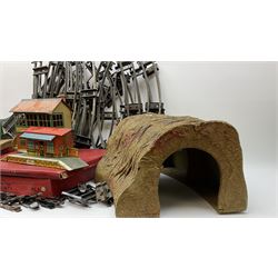Hornby '0' gauge - layout accessories comprising PR1/PL1 Points, CR1 Right Angle Crossing and CA2 Acute Angle Crossing, all boxed; tin-plate signal box; tin-plate level crossing; textured wooden tunnel, possibly pre-WW2; and quantity of track, some boxed; together with '00' gauge tin-plate station