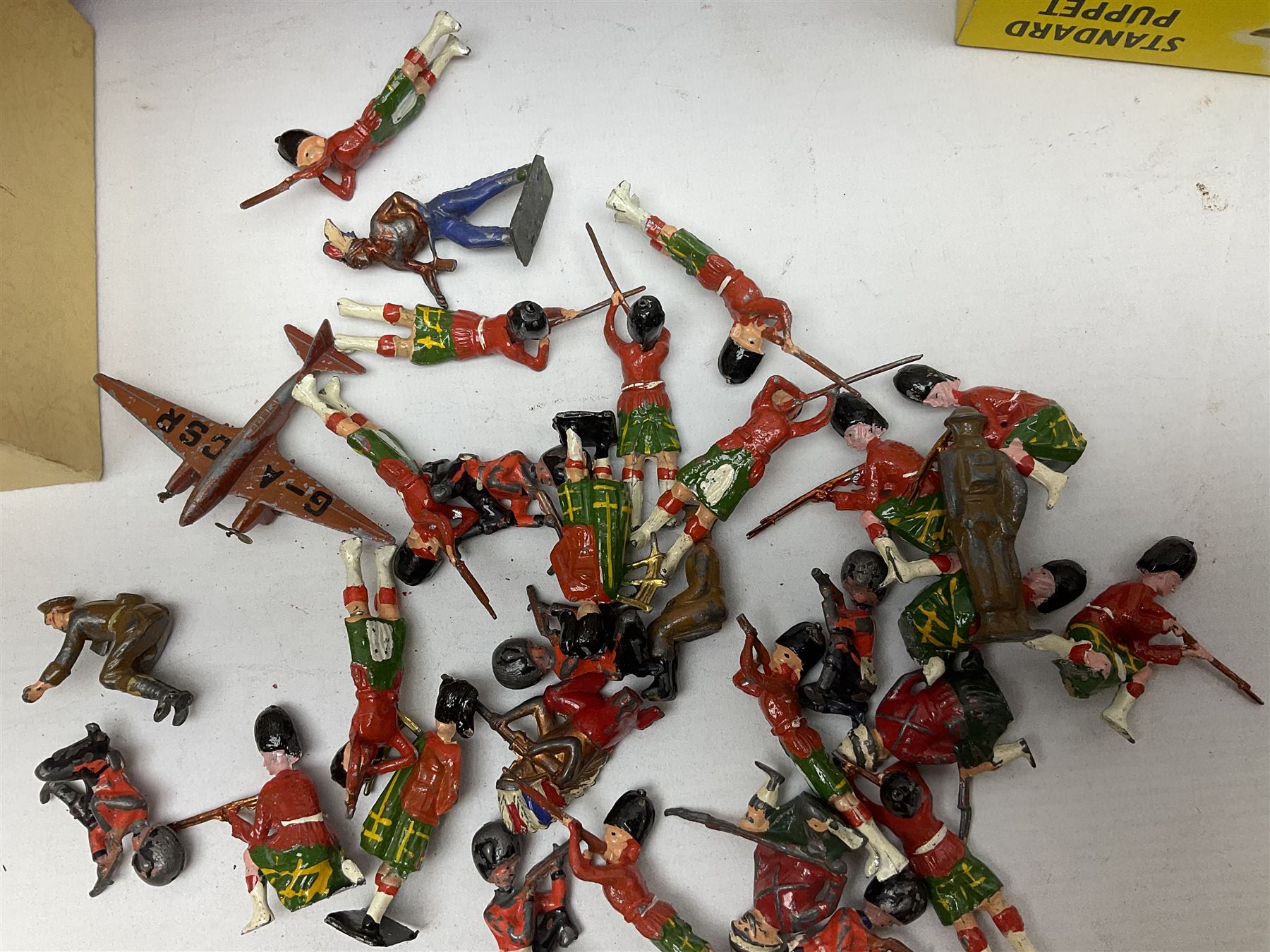 Vintage toys comprising 'Docking RMS Queen Mary' game, two boxed Pelham puppets, quantity of painted metal British soldiers to include Guardsmen, painted farm animal figures