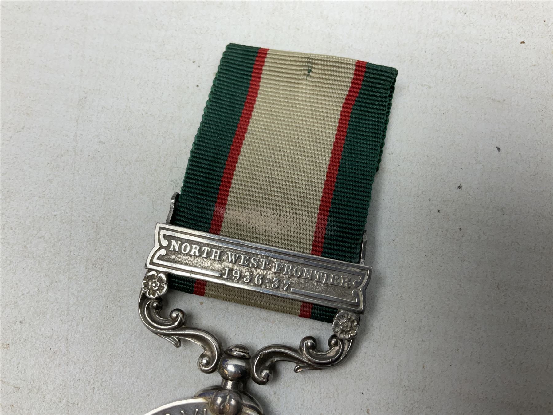 George VI India General Service Medal with North West Frontier 1936-37 clasp awarded to Bearer Khan Akbar 2-Border R.; with ribbon