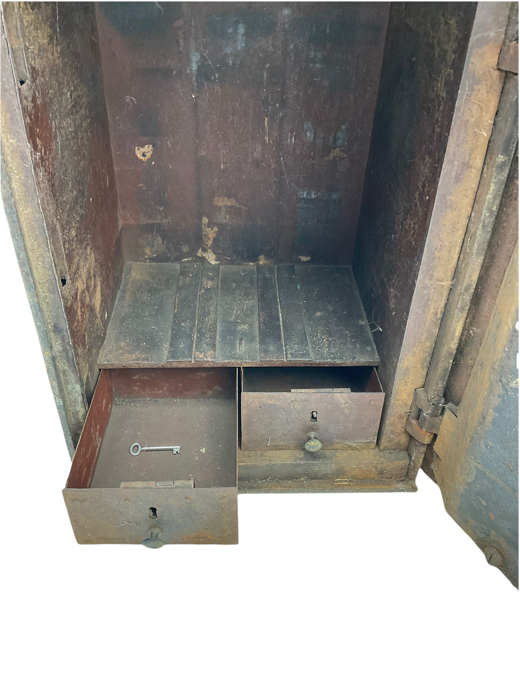 Early 19th century cast iron safe strong box, with key, two internal drawers