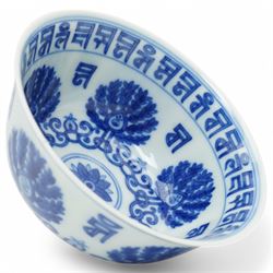 Qing dynasty bowl decorated in blue and white with palmettes and interlocking scrolls with...