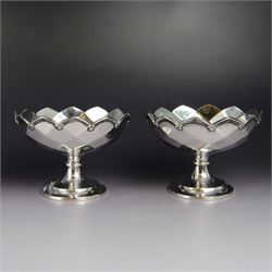 Pair of 1930s silver pedestal bowls, of circular faceted form, upon a circular foot, hallm...