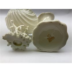 Quantity of Belleek ceramics to include mid-late 19th century jug moulded with green man mask and foliage, date code stamp for 1863-1890, together with later Belleek cornucopia shape vase, jug and other vases together with a Belleek style shell dish raised on branches, tallest H19cm
