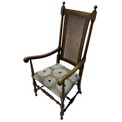 Early 20th century beech framed armchair, upholstered seat and cane back, on turned and block supports united by turned stretchers 