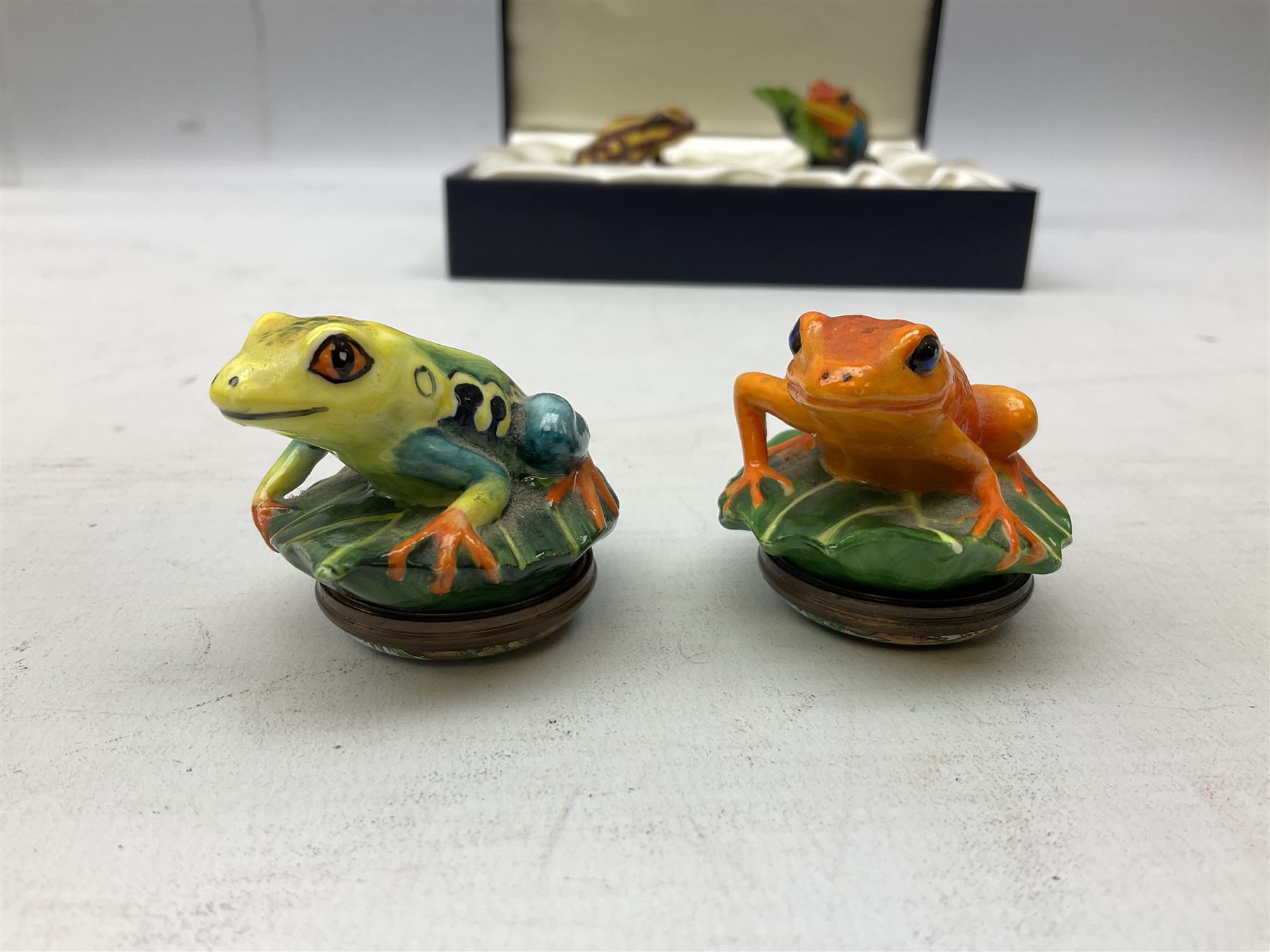 Four Halcyon Days bonbonnieres modelled as frogs, Golden Toad, Red-eyed frog, Dart-poison frog, and Poison Dart frog, in single box 