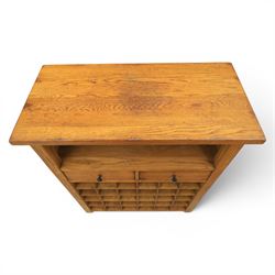Traditional design light oak wine server, rectangular overhanging top above an open undertier with grooves for wine glasses, fitted with two drawers, lower section with open bottle racks for thirty five bottles, raised on square supports