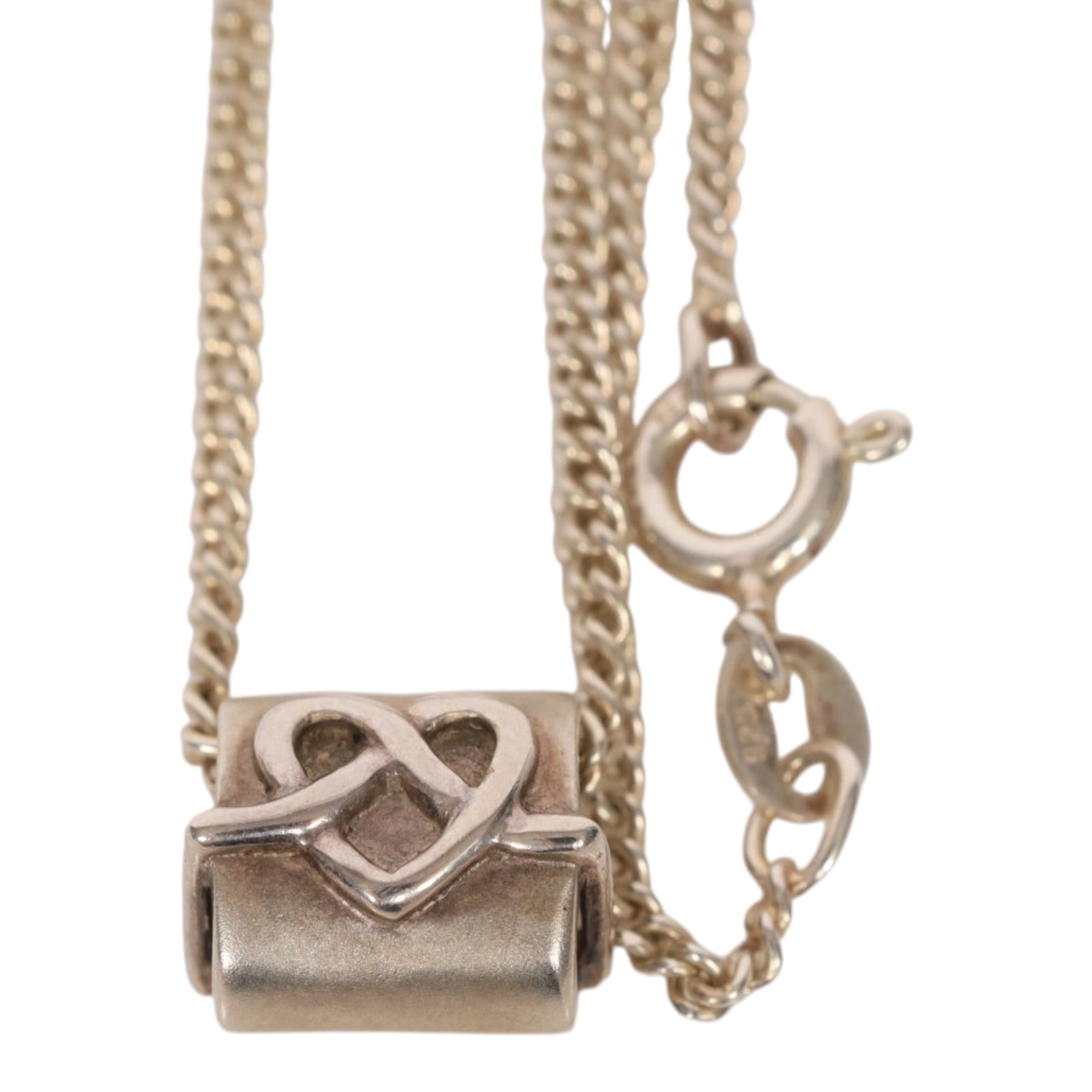 Three 9ct gold rings, silver bangle and pendant necklace