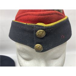 WW2 RAOC field service side cap; and sixteen other predominantly post-war berets, forage caps and side caps, some with badges and some continental (17)