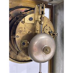 French - Late 19th century 8-day white marble and gilt metal portico clock garniture, the clock surmounted by an urn and raised on a pair of cylindrical pillars above a rectangular plinth base, white enamel dial with Arabic numerals and floral garlands, twin train countwheel striking movement, striking the hours and half hours on a bell, with a sunburst pendulum and gilt Louis XVI hands, garniture with matching twin light candelabra. With Key.   Candelabra H 30cm.