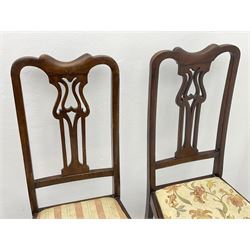 Set four early 20th century beech dining chairs and an early 20th century beech elbow chair, all with shaped and pierced splats