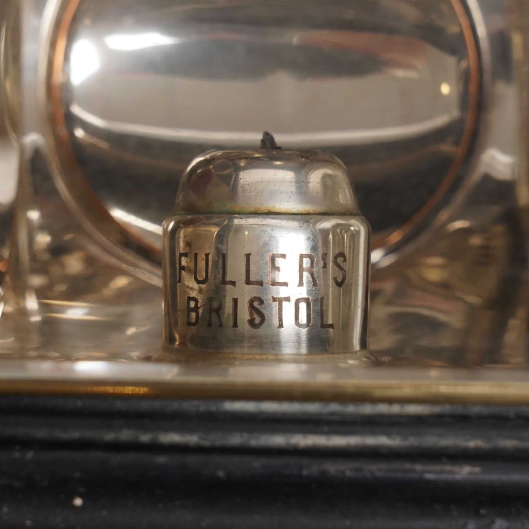 Fuller’s (Bristol) - pair of large Edwardian brass and toleware carriage lamps, the chimney of lobed decoration over a cylindrical body with large circular convex lens with bevelled plate and rear circular red reverse light, on brass cylindrical stem