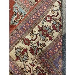 Persian red ground prayer rug, decorated with stylised flowers (201cm x 143cm), and a small Persian design triple medallion rug (142cm x 68cm)