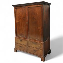 George III mahogany linen press, dentil moulded cornice over a pair of panelled doors enclosing a later fitted interior, lower section with two short over one long cockbeaded drawer, brass swan neck handles, shaped bracket feet