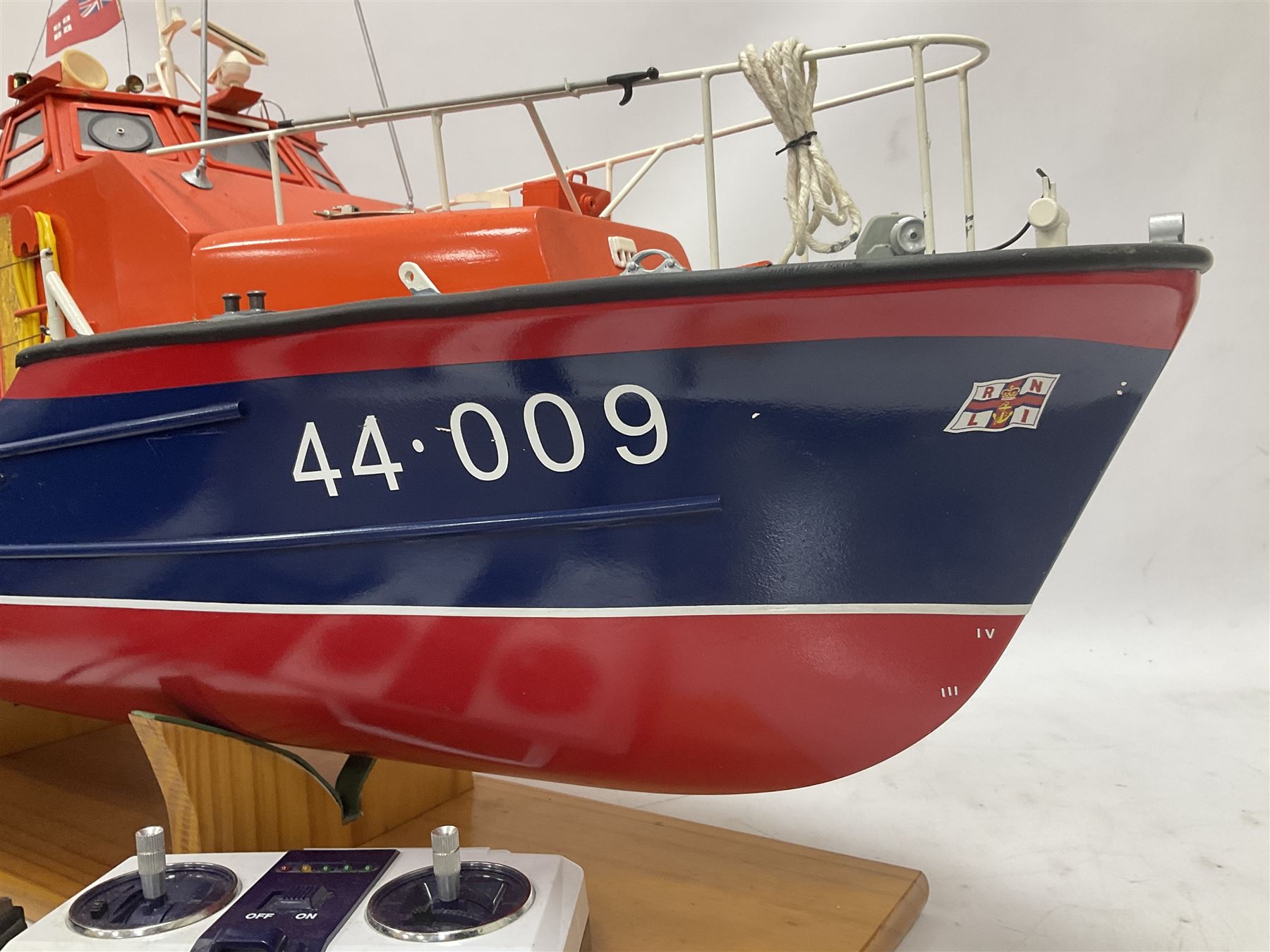 Two remote controlled kit-built plastic model boats - RNLB Sheerness Lifeboat Helen Turnbull L92cm and 'Conserver' Grangemouth L76cm; each on wooden stand; together with three remote control units