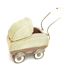 1950s Martin Holtappels plastic woven basketwork doll's pram with floral padded lining, retractable canopy, curving tubular handle, white metal wheel arches and solid rubber tyres L82cm H70cm