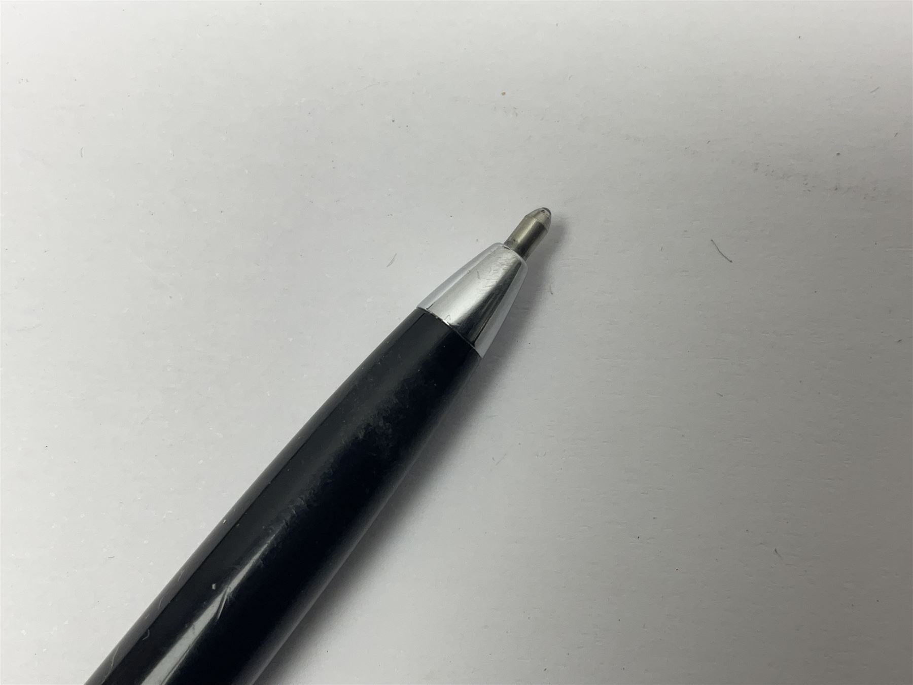 Three fountain pens, to include Conway Stewart 'Dinkie 550' and 'Conway 57' and a Parker 'Slimfold', all with 14ct gold nibs, together two roller ball pens, including a Parker example and a Swarovski Crystal paperweight