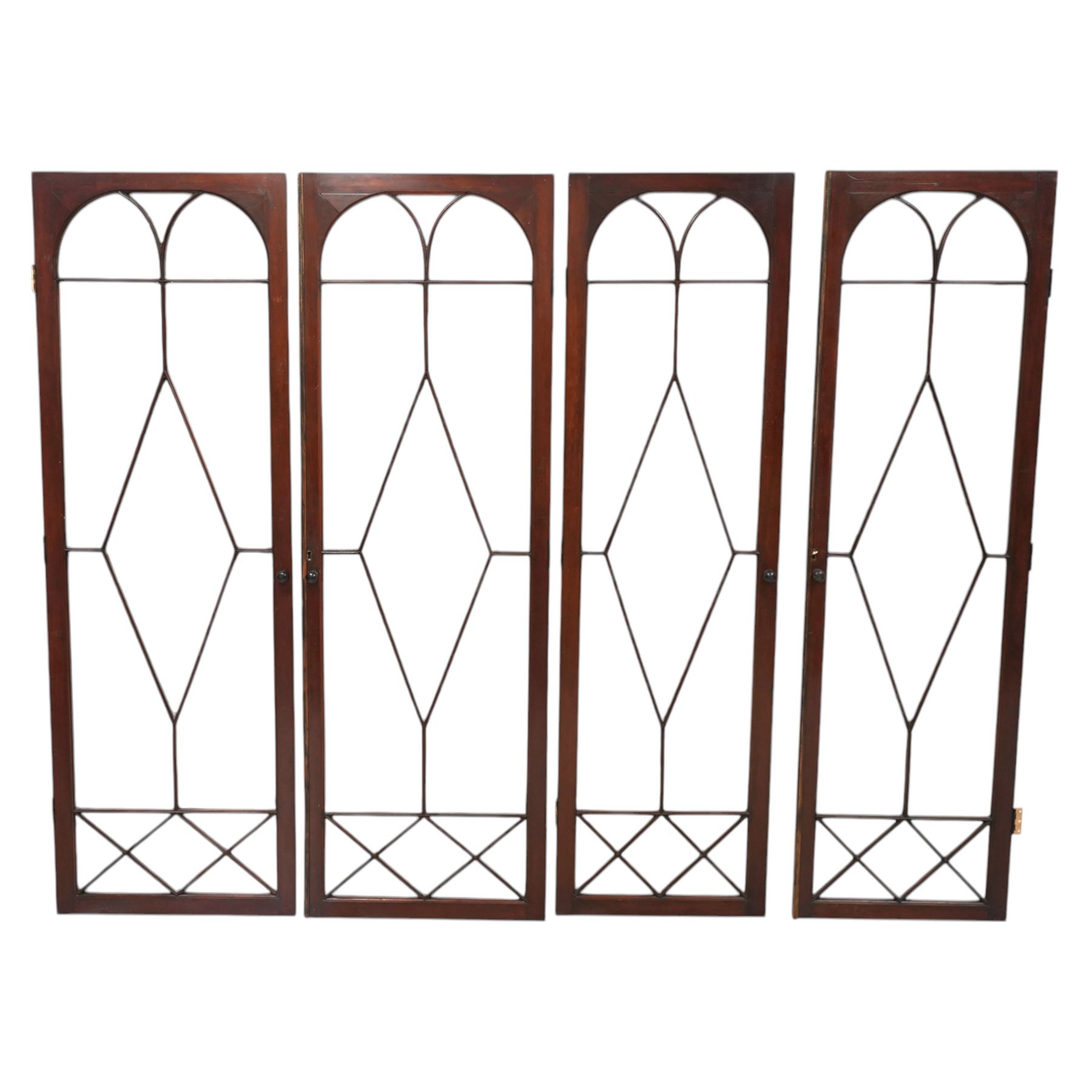 Large Georgian mahogany library bookcase, projecting moulded cornice with row of globular mounts, adjustable shelving enclosed by six astragal glazed doors, fitted with two slides and six panelled cupboard doors, two banks of five drawers, on moulded plinth base; together with two pairs of associated astragal glazed doors in mahogany, from the same property (W55.5cm x H168cm & W48cm x 168cm)