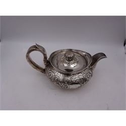George III Irish silver teapot, of squat circular form, the body with repousse and chased floral and C scroll decoration, with capped C handle and ivory insulators, engraved to base 'Presented to Troop Sergeant Major John Percival, of the 4th Dragoon Guards by Alex D. Tait, Esq, late Captain in that corps as a mark of approbation of his steady and upright conduct when Sergeant Major of his Troop, Dublin, June 2nd 1843', hallmarked William Law, Dublin 1817, H12.5cm, This item has been registered for sale under Section 10 of the APHA Ivory Act
