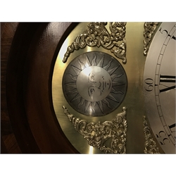 Early 19th century inlaid figured mahogany longcase clock, trunk door flanked by canted corners with twist quarter columns, hood with three finials and stop fluted pilasters, brass and silvered arched dial, Arabic and Roman numerals with seconds subsidiary, eight day movement striking on bell, H224cm (two weights and pendulum)